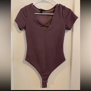 Criss cross women’s body suit